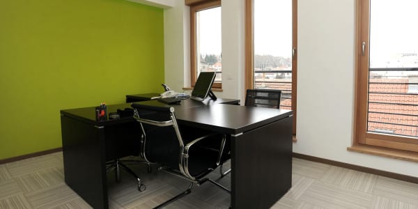 office with windows and black desk